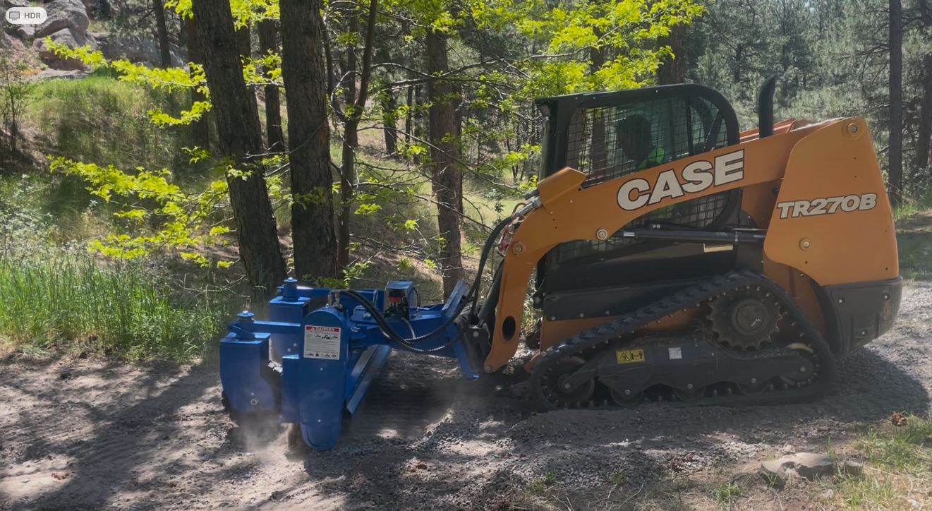 Skid steer with power rake regrading gravel driveway — Boulder County CO