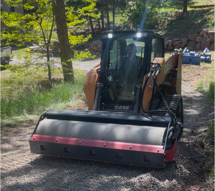Vibratory roller compacting gravel driveway — Front Range Driveway & Gravel